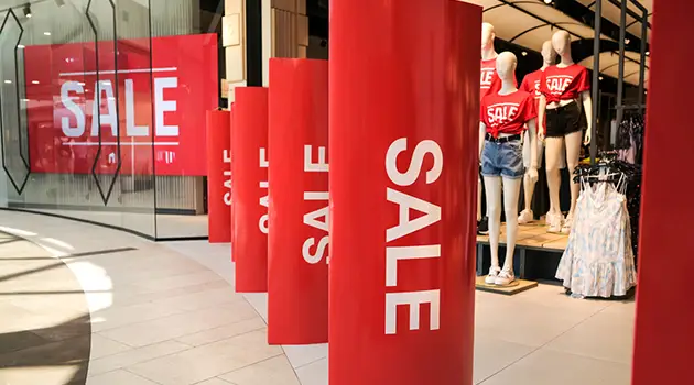 red sale signs apparel store