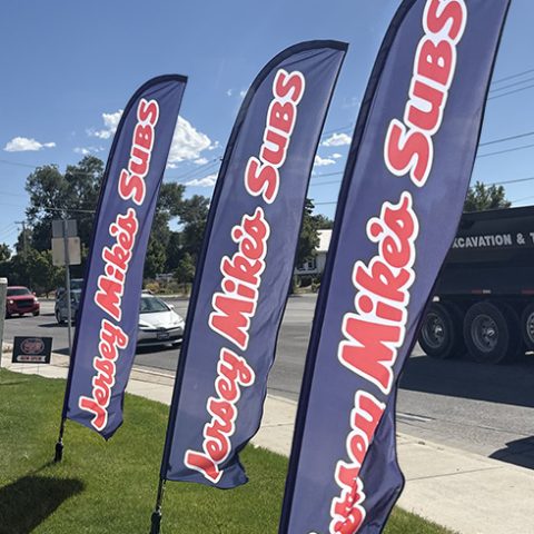 feather flags outside restaurant along side the road