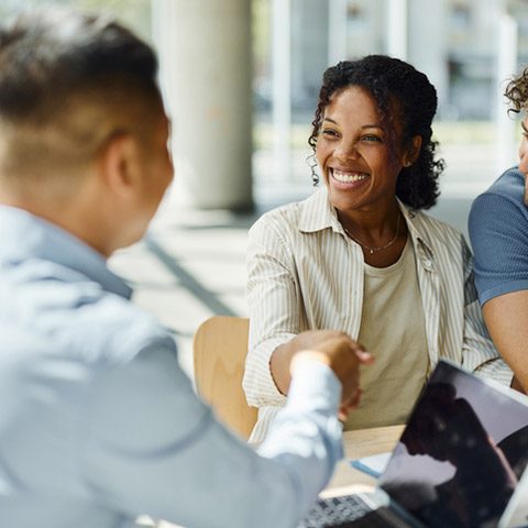 financial advisor shaking hands with client