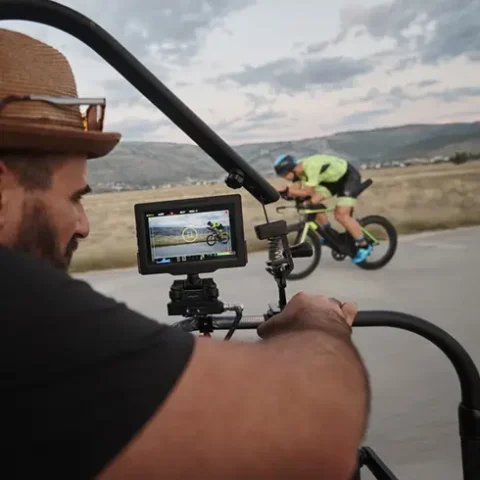 videographer-filming-cyclist video grapher filming cyclist