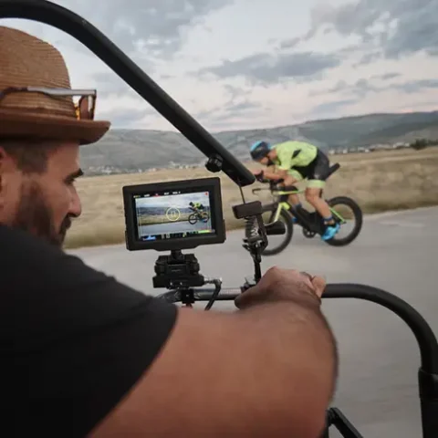 video grapher filming cyclist